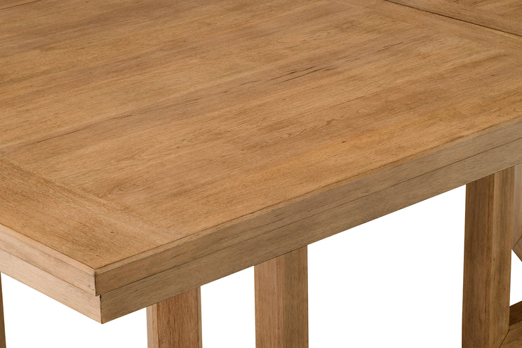 Close-up of a wooden table with a light brown finish